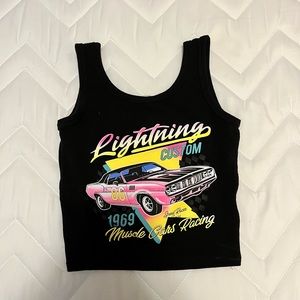Selling a cropped black camisole with car design. It’s a juniors XS